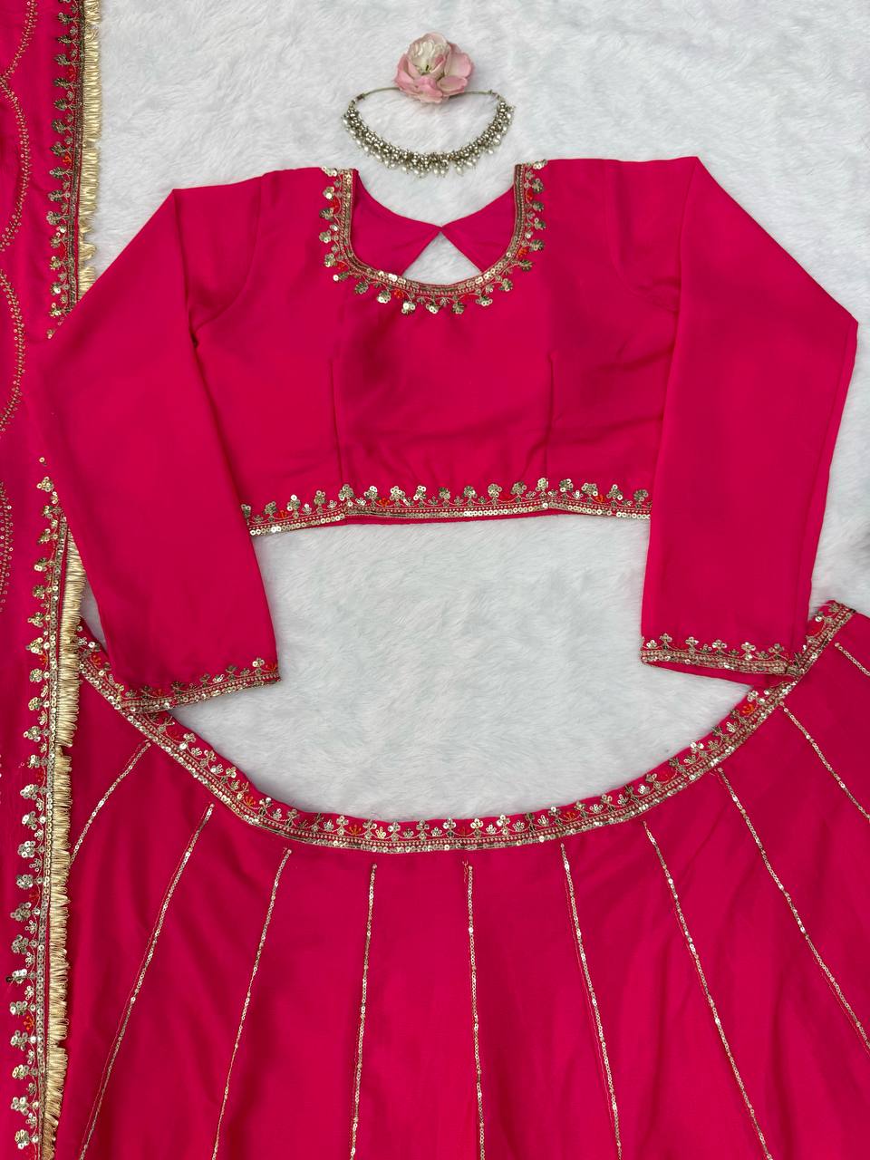 Radiant Rani Pink Silk Lehenga Choli Adorned with Opulent Heritage Floral Motifs and Intricate Zari Borders